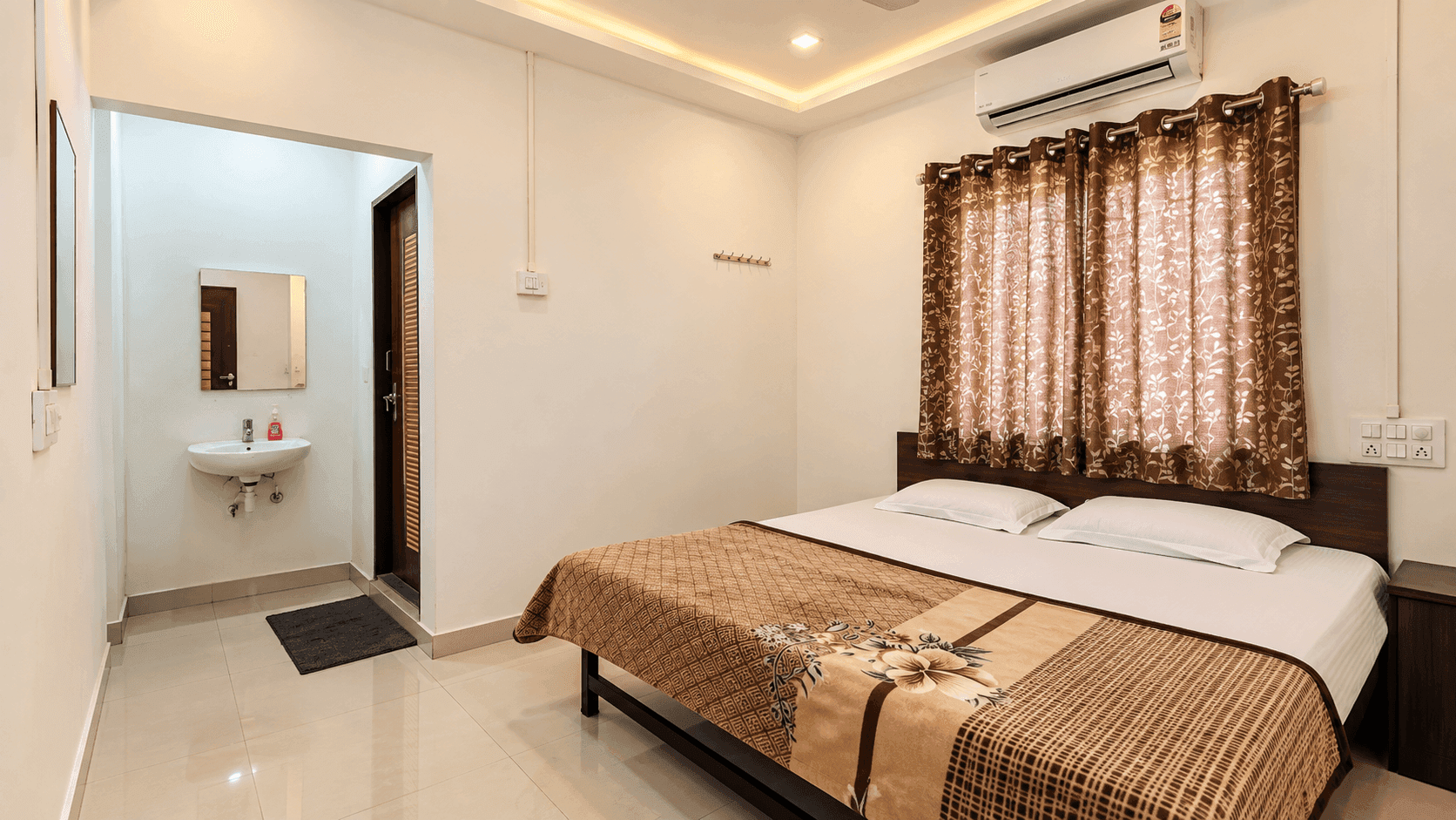 Air-conditioned deluxe bedroom with comfortable linen